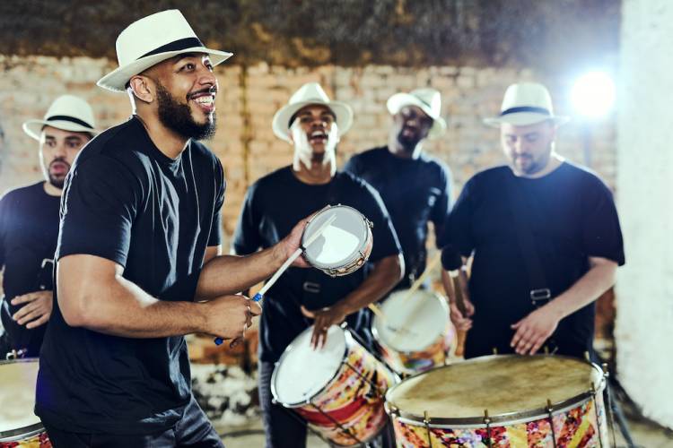 Shot of a group of musical performers playing together indoors