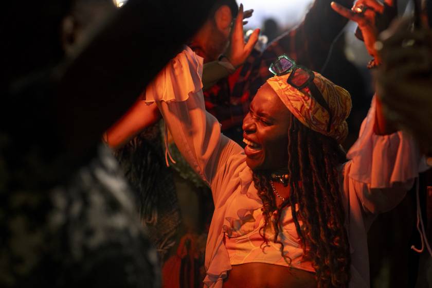 Black woman dancing to music 